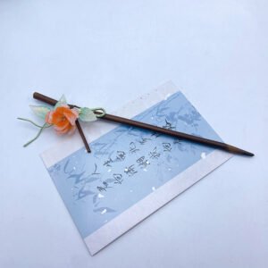Pin de cabello de flor naranja