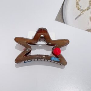 Estrella de café y clip de garras de punto rojo