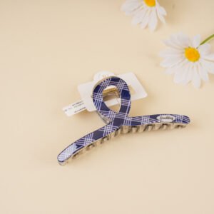 Pinza de pelo azul a cuadros con puntos